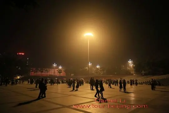 Local people are seen singing and dancing