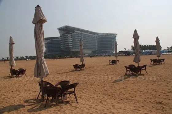 A 5 star hotel is under construction. Wicker chairs, and umbrella