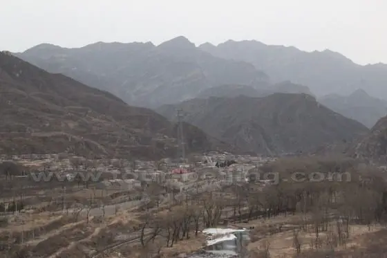 A bird's-eye view of the Yanhechang Village. The village is surrounded by the mountain with Yongding River passing through to its north.