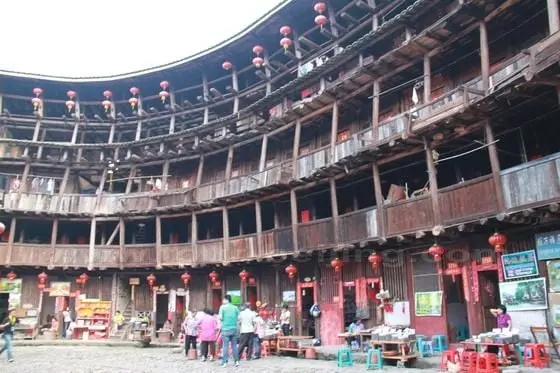 A close look at the wooden structure of the floors inside the clay building.