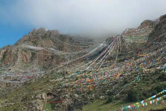 A mountain of five coloured prayer flags