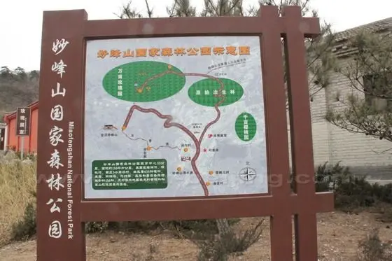 A signboard stands inside the gate indicating the location of Jiangou Village - the heart of the Miaofengshan Forest Park.