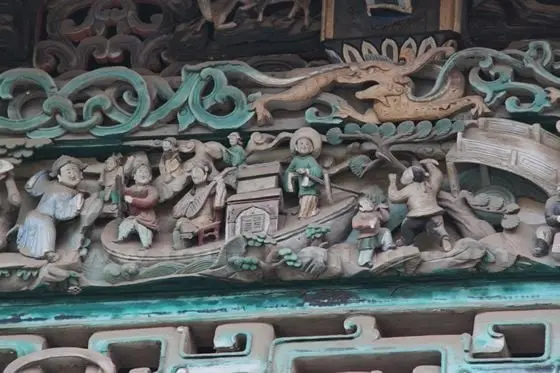 A vivid wood carving of folk custom