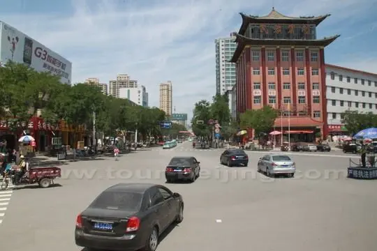 At a crossroad with Linxia Hotel at the front