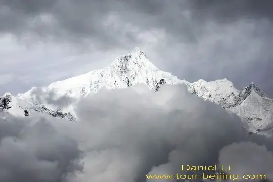 Clouds are closing in on Kawagebo Peak