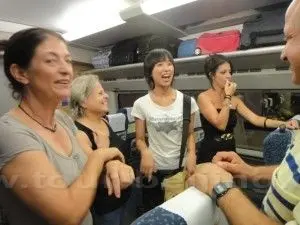 Daphne with the group on the tourist bus having a happy time.