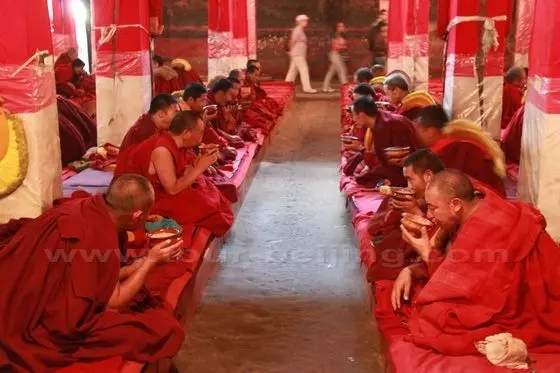 Each monk has a bowl of barley congee