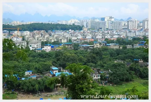 The apartment blocks below at a distance seen from the top of the hill.