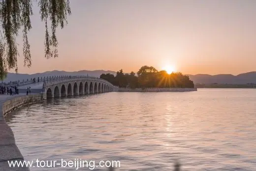 The beautiful sunset over the bridge and Kuming Lake in Summer Palace
