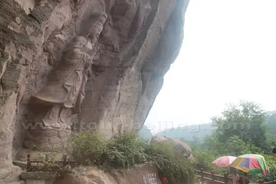 Godess of Mercy carved on the cave turned temple