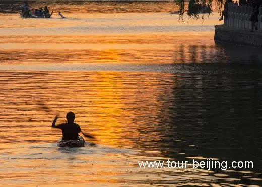 Boating on the golden surface of Houhai Lake.