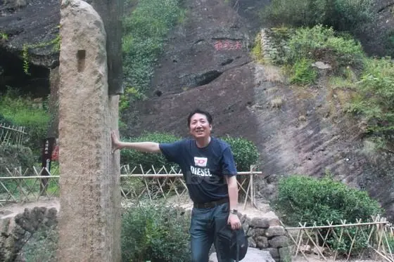 I took a stereotyped picture below the Mother Tea Trees of Da Hong Pao