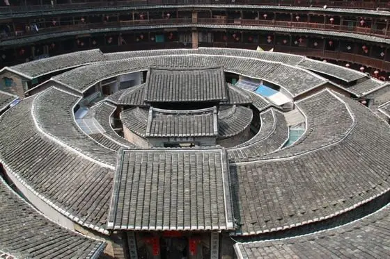 It has three concentric ring buildings inside the large earthen house