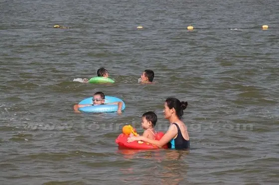 Kids are happy playing on the sea.
