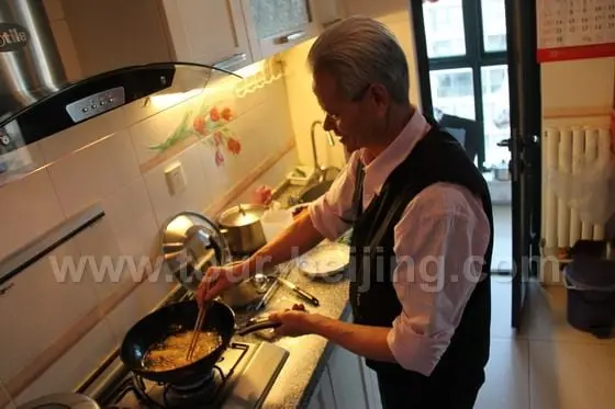 My father in law has made all the new year food. Now he is deep frying the spring rolls.
