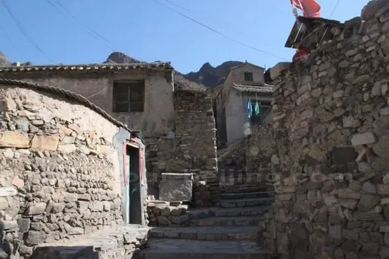 Now we cross the main street road and walk up the northern part of the village from west to east.
