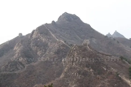 Now we turn west and see the Zhuzishan Mountain where three sections of the Wall are met