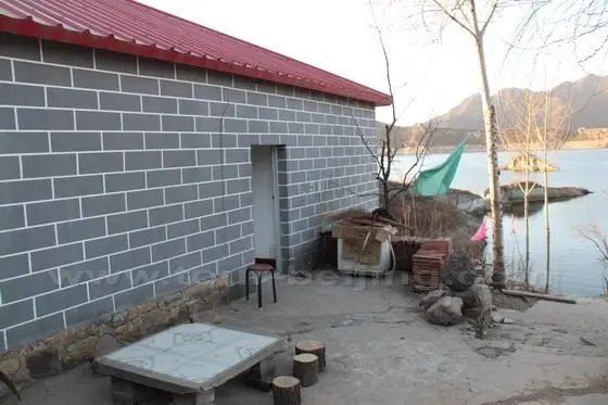 On the right side of the farmhouse, you are still able to see the wall submerged in water