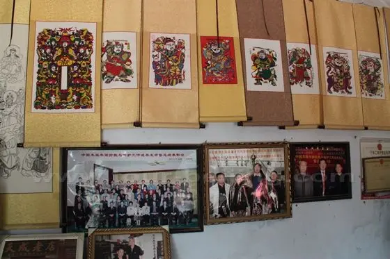 On the wall hung with his works of arts and photos