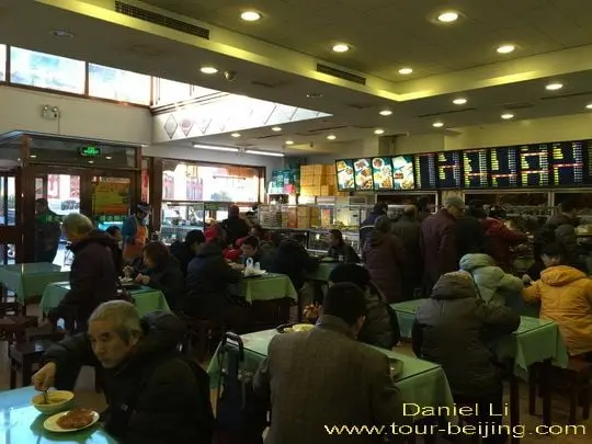 The restaurant is packed with eaters.
