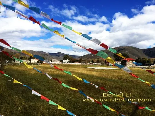 Prayer flags and Muya Village