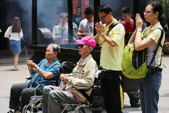 Praying at Shanghai City God Temple