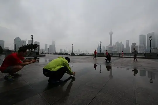 Rainwater reflections of Pudong Skyline on the Bund (6)