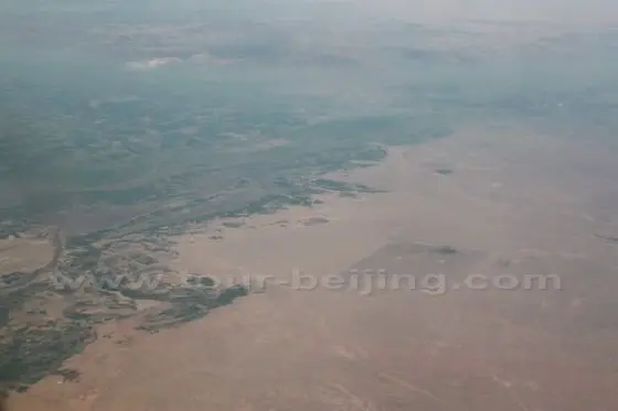Sharply divided land - green belt and desert