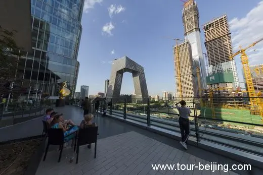 Drinking on the terrace while looking out at the two landmarks in Beijing