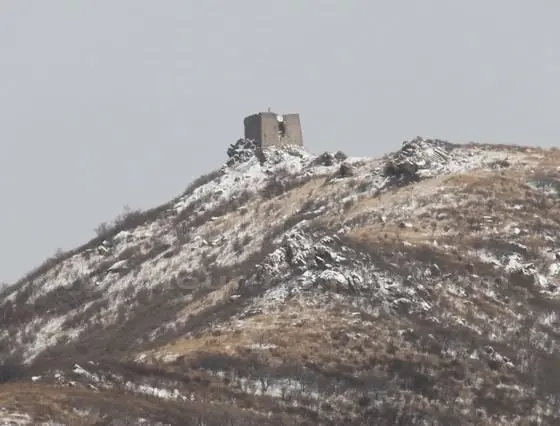 Standing on the round stone mound, you can see the highest wacth tower of the Great Wall around Beijing with the sea-level of 1400 meters