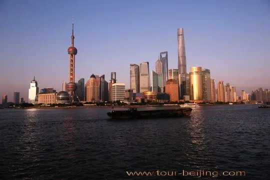 The sunset glow sheds on the skyscrappers