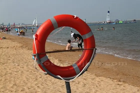 Swim Buoyancy and a naked boy playing at the beach