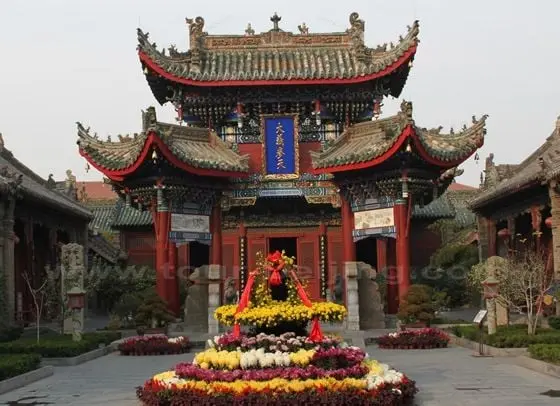 The Decorated Archway with two three-legged poles supporting the Pailou.
