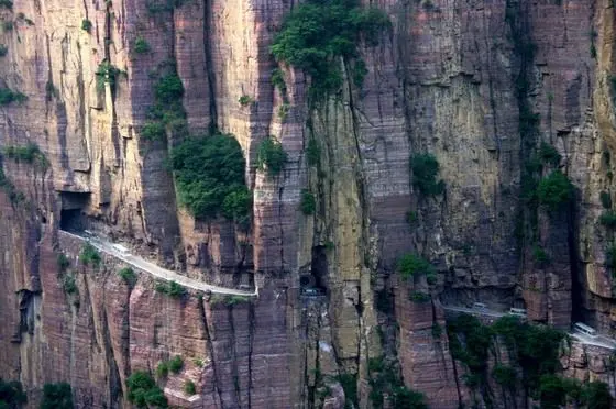 The carved tunnel rock road seen from the opposie cliff