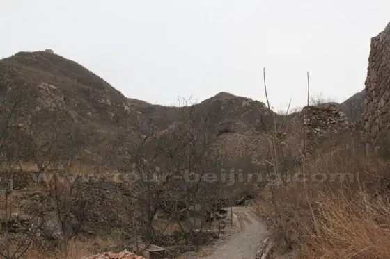 The city wall in the south of the fort village, you still can see the remaining wall and the lonely watch tower perched on the hilltop above the village.
