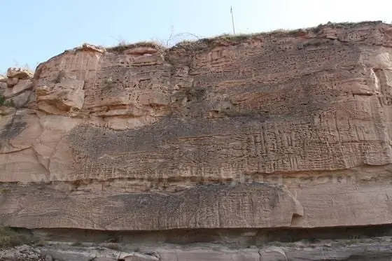 The eroaded rock resembling a buddhist book