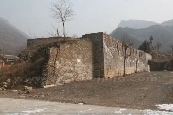 The historical record says there used to be three-storey building in the fort (pass city). The building base is there with an archway door.