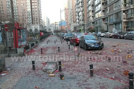 The main streets in our communitiy are covered with tattered red-paper and cardboard casings from spent fireworks last night.