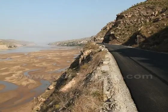 The newly asphalt highway is designed to develop the tourism industry