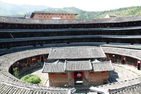 The outer ring has four storeys while the inner ring has just one story. The center is the clan temple.