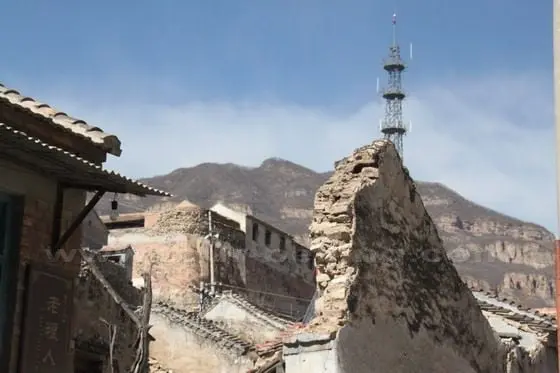 The singal tower reminds people of the village in the 21th century.