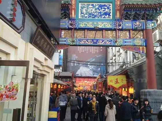 The snack street is packed with food vendors, souveniors stands, and candy shops.