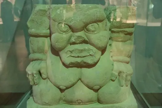 The stone pedestal of a figure