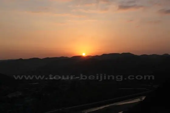 The total sun is over the mountains