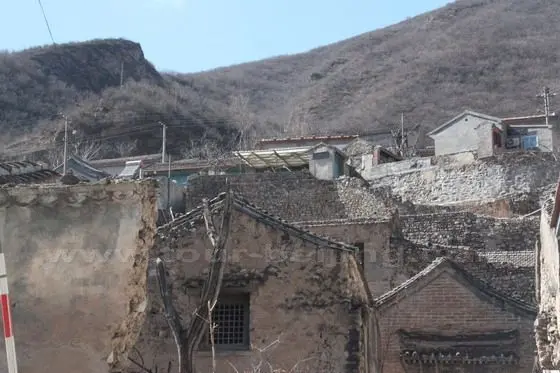 The village houses are perched on the hillside.