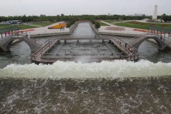 The water of the man made river first enters the Nine Dragon Pond
