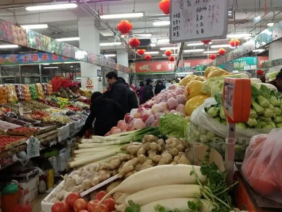 The whole market is piled up with various kinds of vegetable and fruits