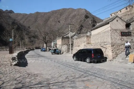 This is the east-west street road in front of the village houses.