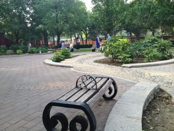 To the west of the Divine Warehouse and Divine Kitchen is a garden with pretty wooden benches