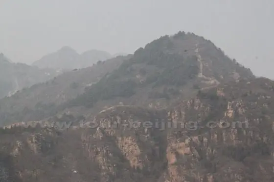 To the west of the Village across the valley, we find the distant Great Wall still visible on the high mountain.